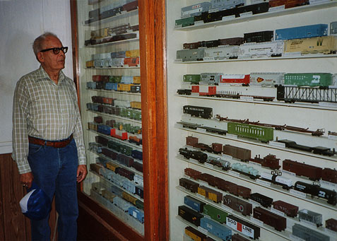 Kenneth J. Johnson by his car replicas at North Dakota State Railroad Museum, Bismarck.